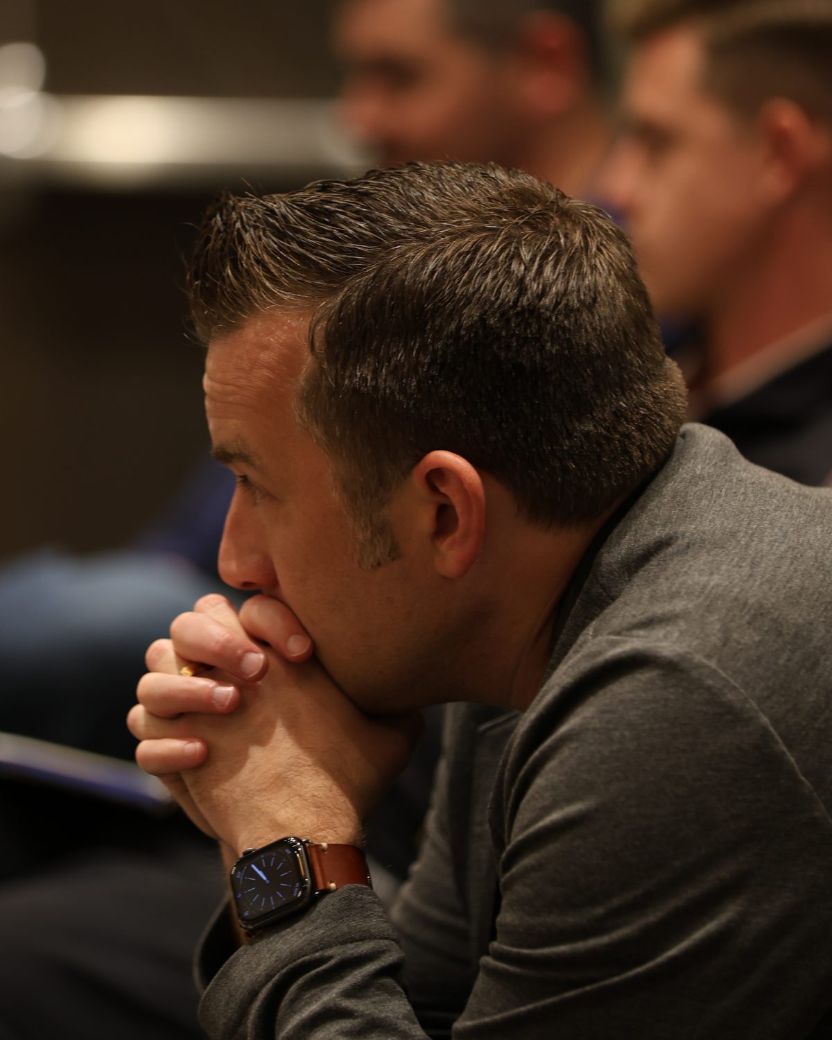 An agency owner listening closely during a session at a past retreat