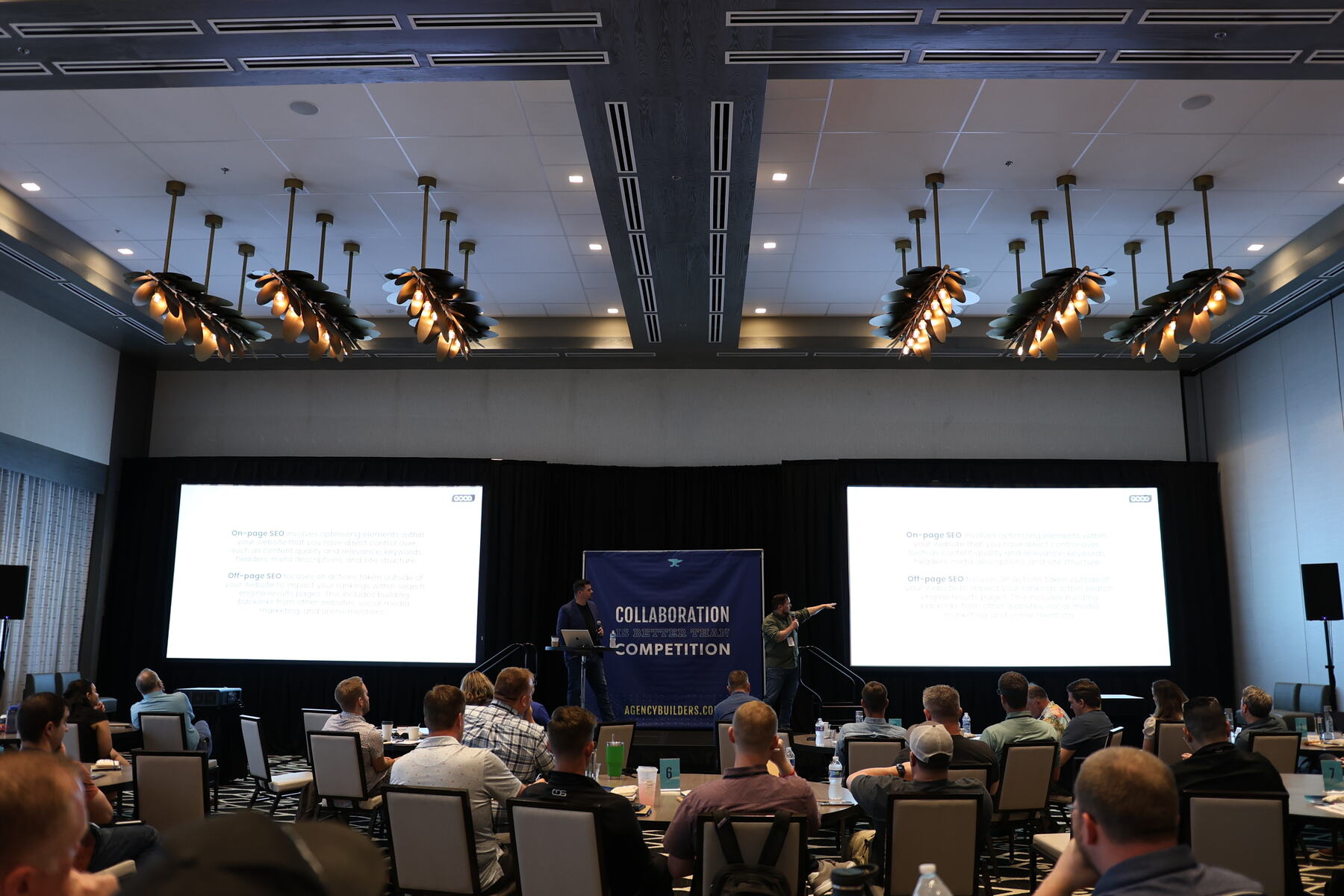 The full ballroom of agency owners facing the stage at a past retreat