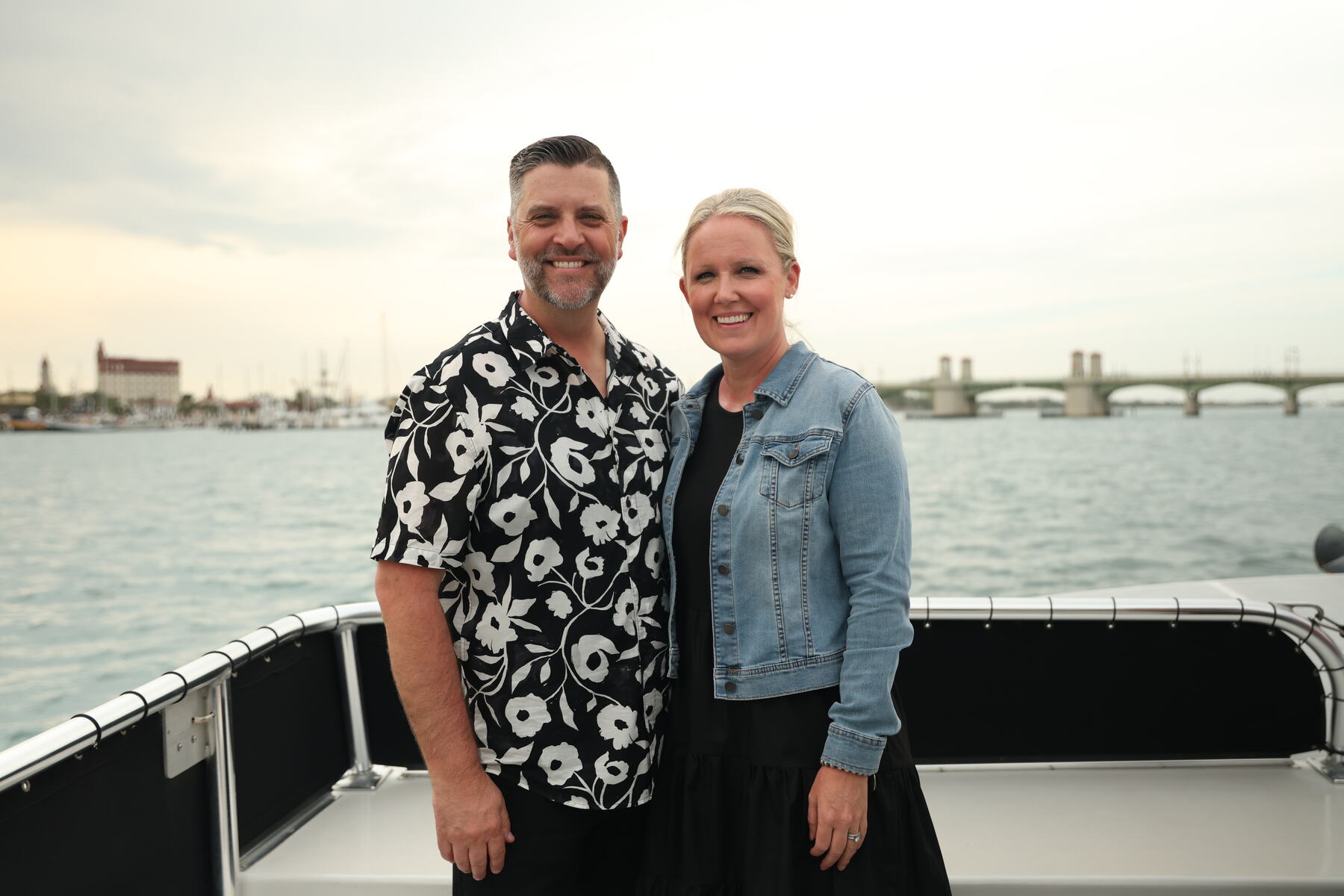 A couple smiling together on a boat on the water in St. Augustine